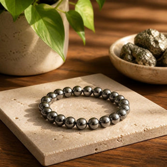 Natural Hematite bracelet with polished metallic grey beads on a cream stone – World of Oorja