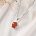 Carnelian pendant Classic bezel setting — faceted stone close view