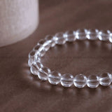 Clear Quartz bracelet worn on wrist for amplifying intentions and clarity - lab certified natural crystal