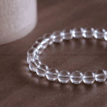 Clear Quartz bracelet worn on wrist for amplifying intentions and clarity - lab certified natural crystal