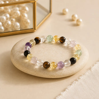 Exam Focus and Success bracelet with tiger eye, amethyst, citrine, clear quartz and fluorite beads on a beige stone – World of Oorja