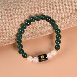 Gemini Green Aventurine and Milky Quartz zodiac bracelet flat lay