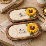 Happy Rakhi sunflower dough bowl candle — carved oval wooden bowl with sculpted wax sunflower, pearls and letter beads