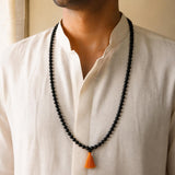108+1 Karungali Jaap Mala worn by a man