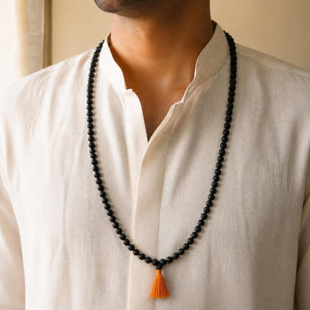 108+1 Karungali Jaap Mala worn by a man