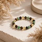 Money Attraction bracelet with citrine, green aventurine and tiger eye beads with gold accents on a stone plinth – World of Oorja