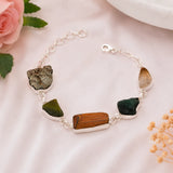 Raw Dhan Yog bracelet on soft pink background - natural raw crystals for money and abundance