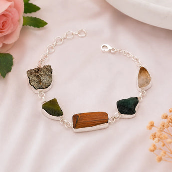 Raw Dhan Yog bracelet on soft pink background - natural raw crystals for money and abundance