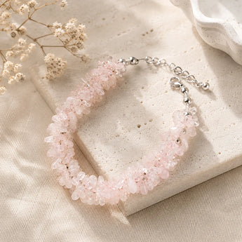 Rose Quartz chips bracelet with raw blush pink nuggets, silver spacers and lobster clasp on a cream stone tile – World of Oorja