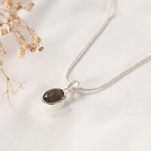 Smoky Quartz Pendant by World of Oorja – natural smoky quartz stone in a silver bezel setting on a fine chain, worn for grounding and protection