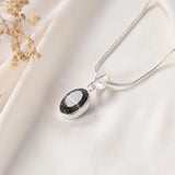 Sulemani Hakik pendant Classic bezel setting angled view on silver chain
