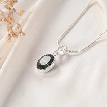Sulemani Hakik pendant Classic bezel setting angled view on silver chain