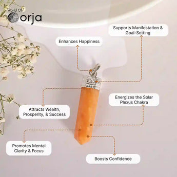 Orange crystal pendant with silver top on a white background, featuring Orja brand, with text about its benefits.