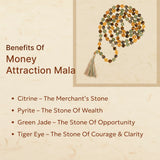 Money attraction mala with stones and tassel on a beige background