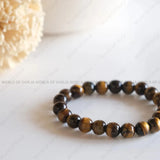 Beaded bracelet on a white surface with 'World of Dorja' branding.