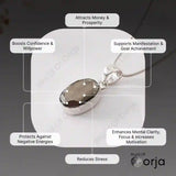 Silver pendant with text on its benefits on a dark background, featuring the brand 'Orja'.