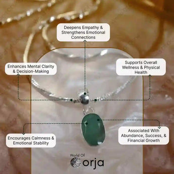 Silver bracelet with a green stone pendant on a blurred natural background, featuring Orja brand.