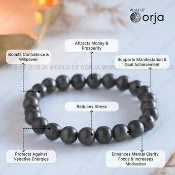 Black beaded bracelet with various benefits listed on a light background, branded 'World of Orja'.