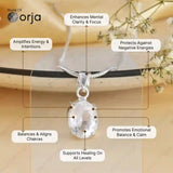 Silver pendant on a necklace with Orja branding, featuring benefits text on a blurred floral background.