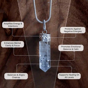 Crystal pendant necklace with labeled benefits on a wooden background