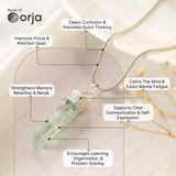 Necklace with a green crystal pendant on a light background, featuring Orja brand.