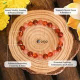 Energy & Vitality Bracelet beaded with crystal beads and descriptive text on a wooden background