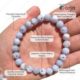 White beaded bracelet on a hand with labeled benefits, branded 'World of Orja'.