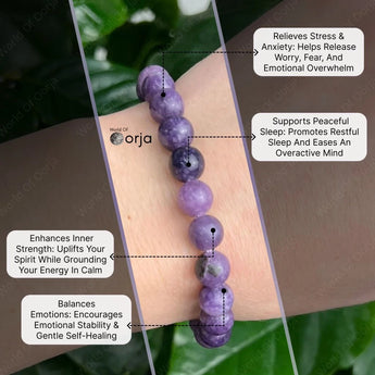 Purple beaded bracelet on a wrist with text highlighting its benefits, branded 'World of Orja'.