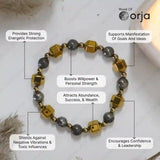 Bracelet with gold and gray beads on a white background, featuring Orja brand.