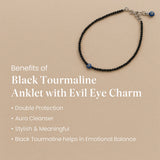 Black tourmaline anklet with evil eye charm on a beige background