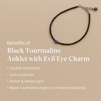 Black tourmaline anklet with evil eye charm on a beige background