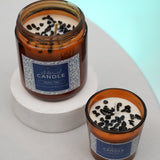 Crystal-infused candle with black tourmaline for protection, grounding, and strength