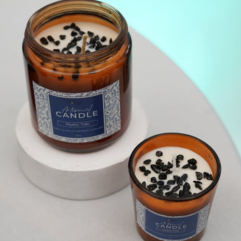 Crystal-infused candle with black tourmaline for protection, grounding, and strength