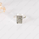 Pyrite ring on a white background