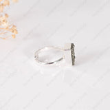 Silver ring with a Pyrite stone on a white background