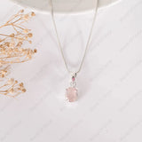 Necklace with a pink pendant on a white background