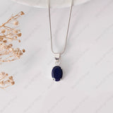 Silver necklace with a blue pendant on a white background
