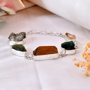 Raw Dhan Yog Bracelet made with natural Pyrite, Citrine, Tiger Eye, Green Aventurine, and Jade crystals for wealth, prosperity, and abundance attraction. Energized crystal bracelet for money luck and success.