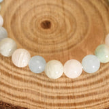 Bracelet with round beads on a wooden surface