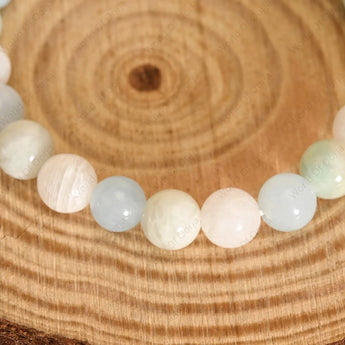 Bracelet with round beads on a wooden surface