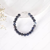 Beaded bracelet with silver clasp on a white background