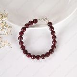 Ruby bracelet on a white background with small flowers