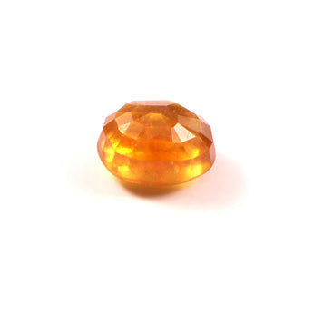 Faceted orange gemstone on a white background