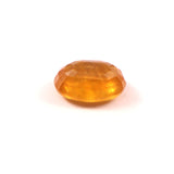 yellow sapphire (pukhraj) 7.22 carat stone on white background 