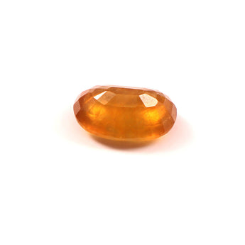 yellow sapphire (pukhraj) 7.34 carat stone on white background 