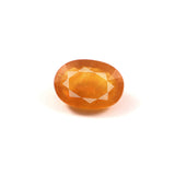 yellow sapphire (pukhraj) 6.39 carat stone on white background 