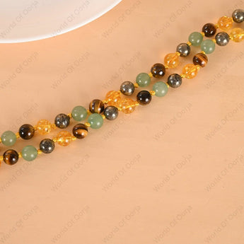 Necklace with multicolored beads on a beige surface