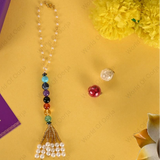 Colorful beaded rakhi with a card on a yellow background