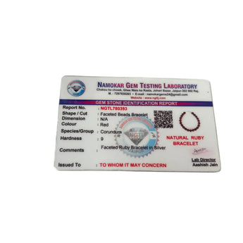 Gem Testing Laboratory identification card for natural ruby silver bracelet on a white background
