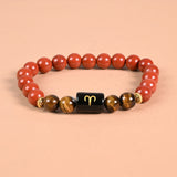 Aries zodiac bracelet with Aries glyph engraved onyx bead, Red Jasper and Tiger's Eye
